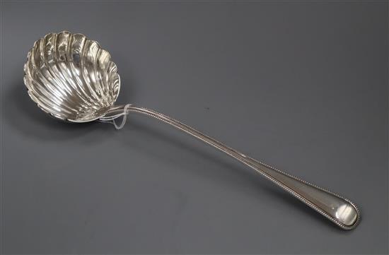 A Victorian silver beaded Old English pattern soup ladle by George Adams, London, 1869, 8 oz.